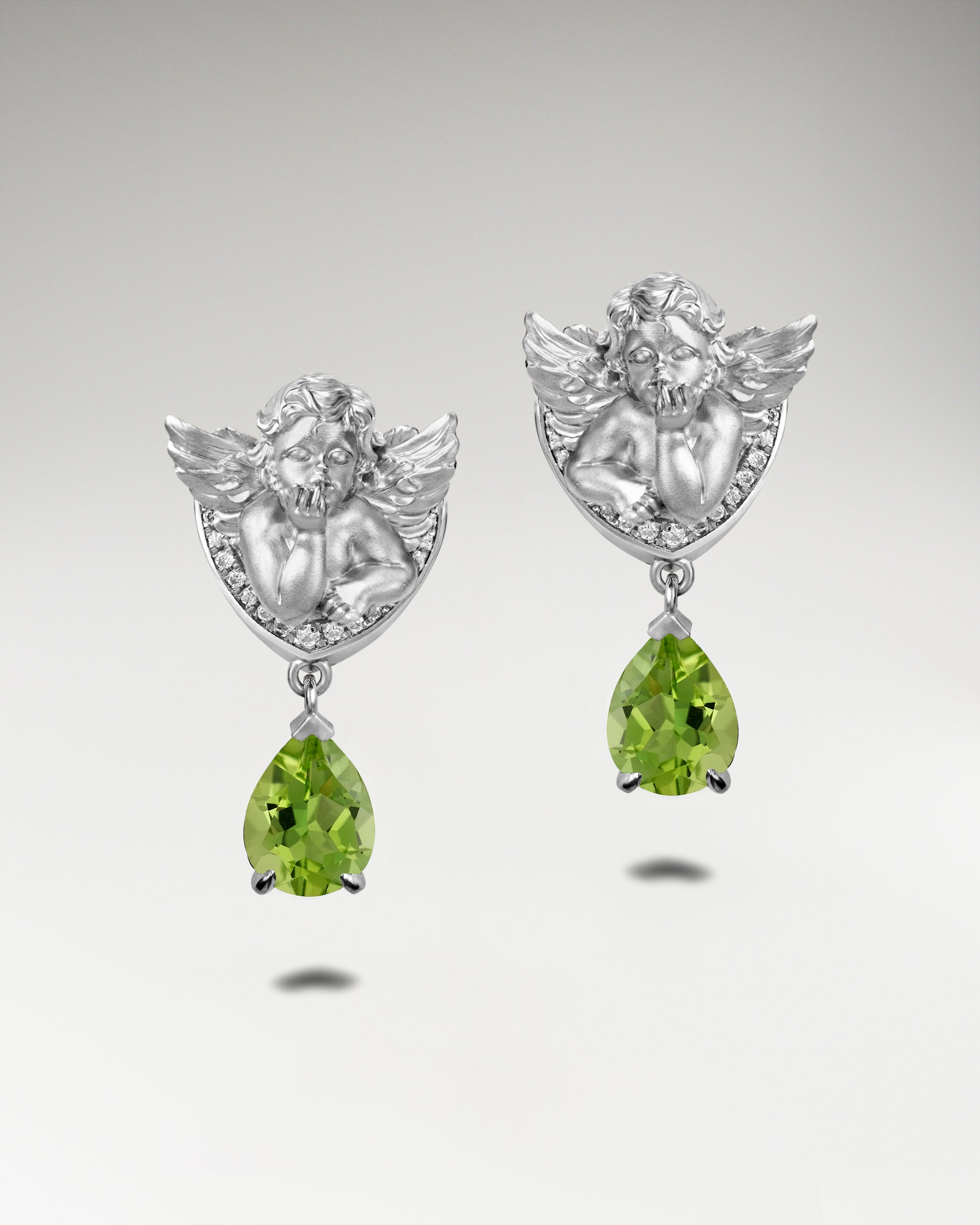 Winged Serenity Earrings In Sterling Silver With Topaz