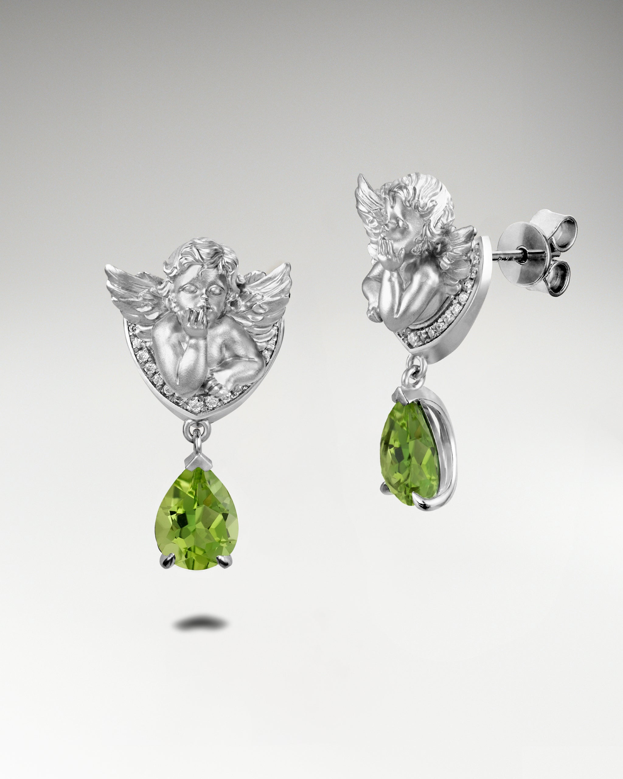 Winged Serenity Earrings In Sterling Silver With Topaz