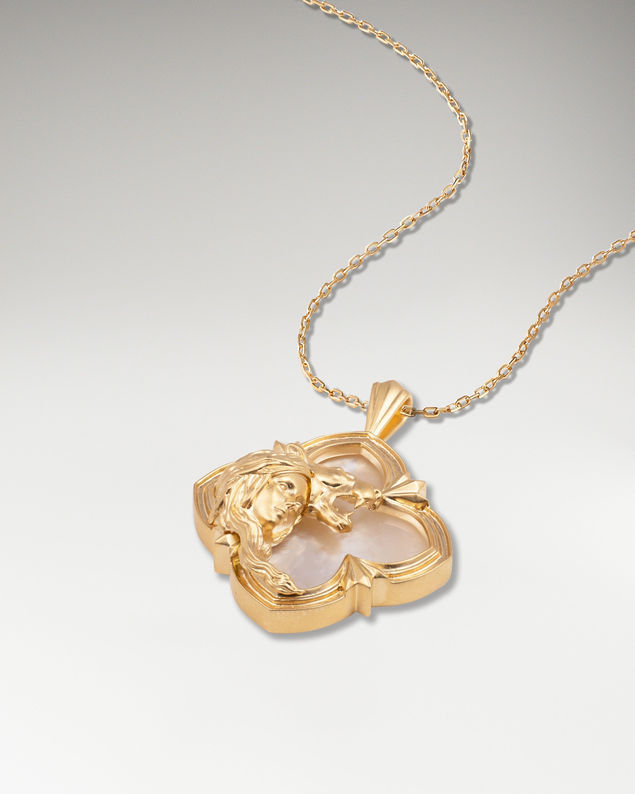 Gold pendant necklace with nacre in a wild encounter design