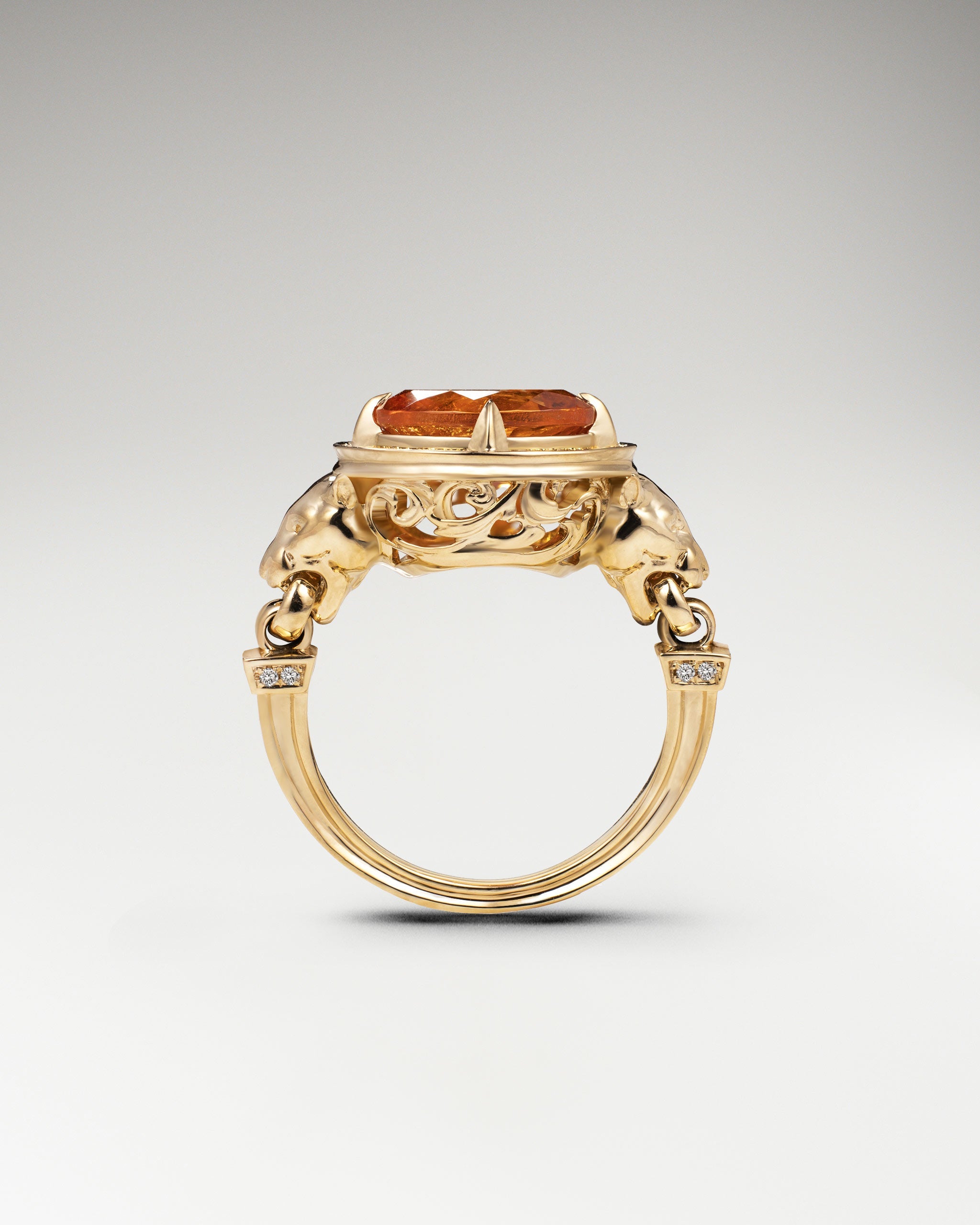 18k gold lion ring with Fanta garnet and diamonds.