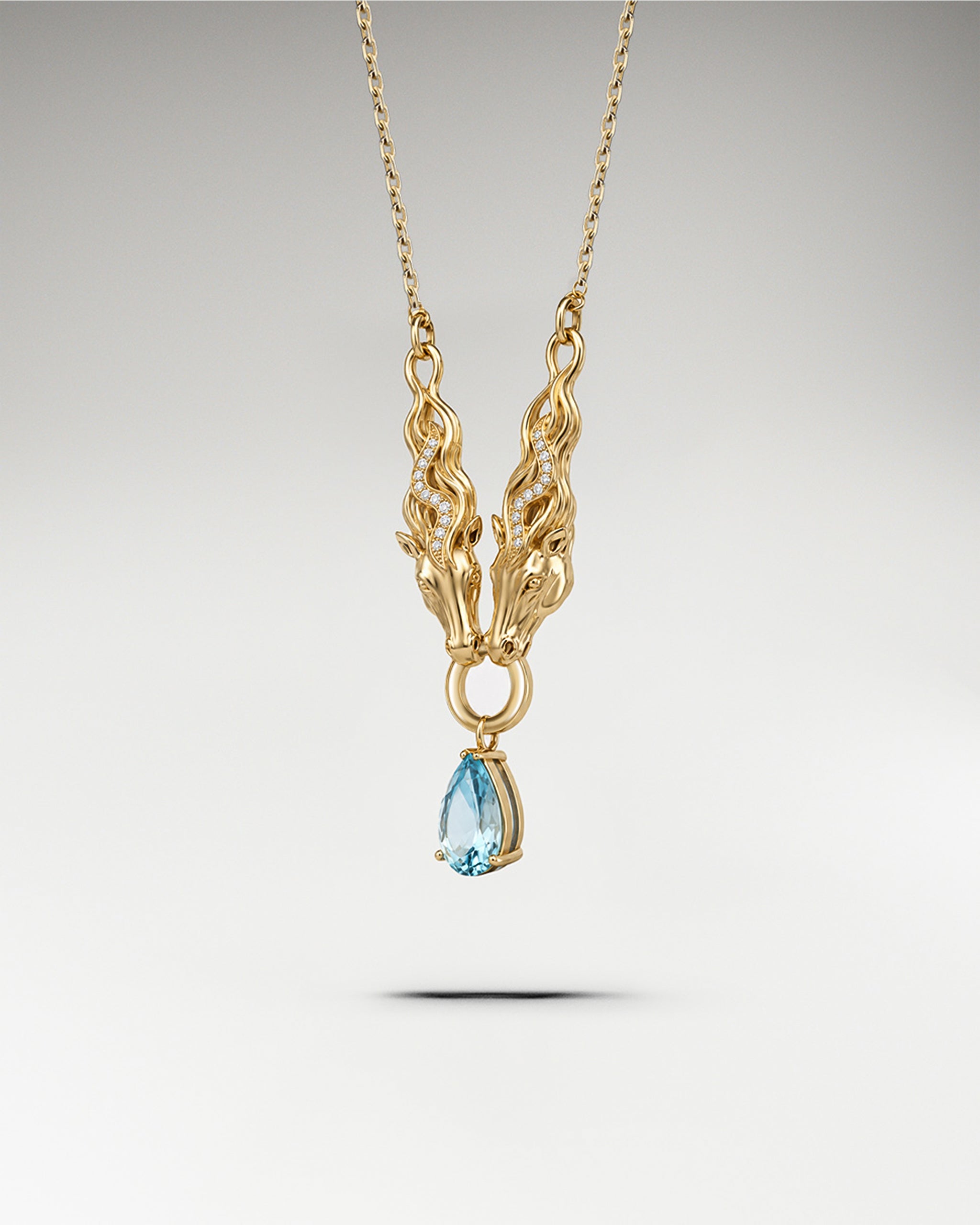 Dual Stallion Pendant In Sterling Silver With Topaz