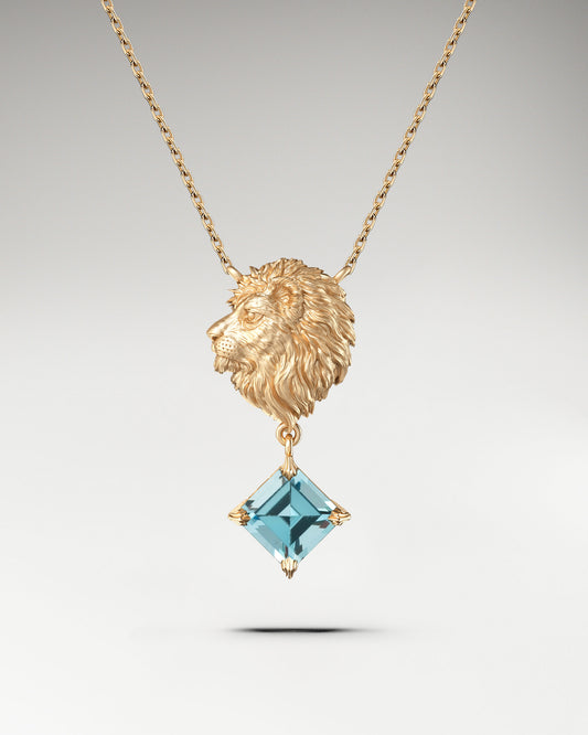 Golden lion head pendant necklace with aquamarine