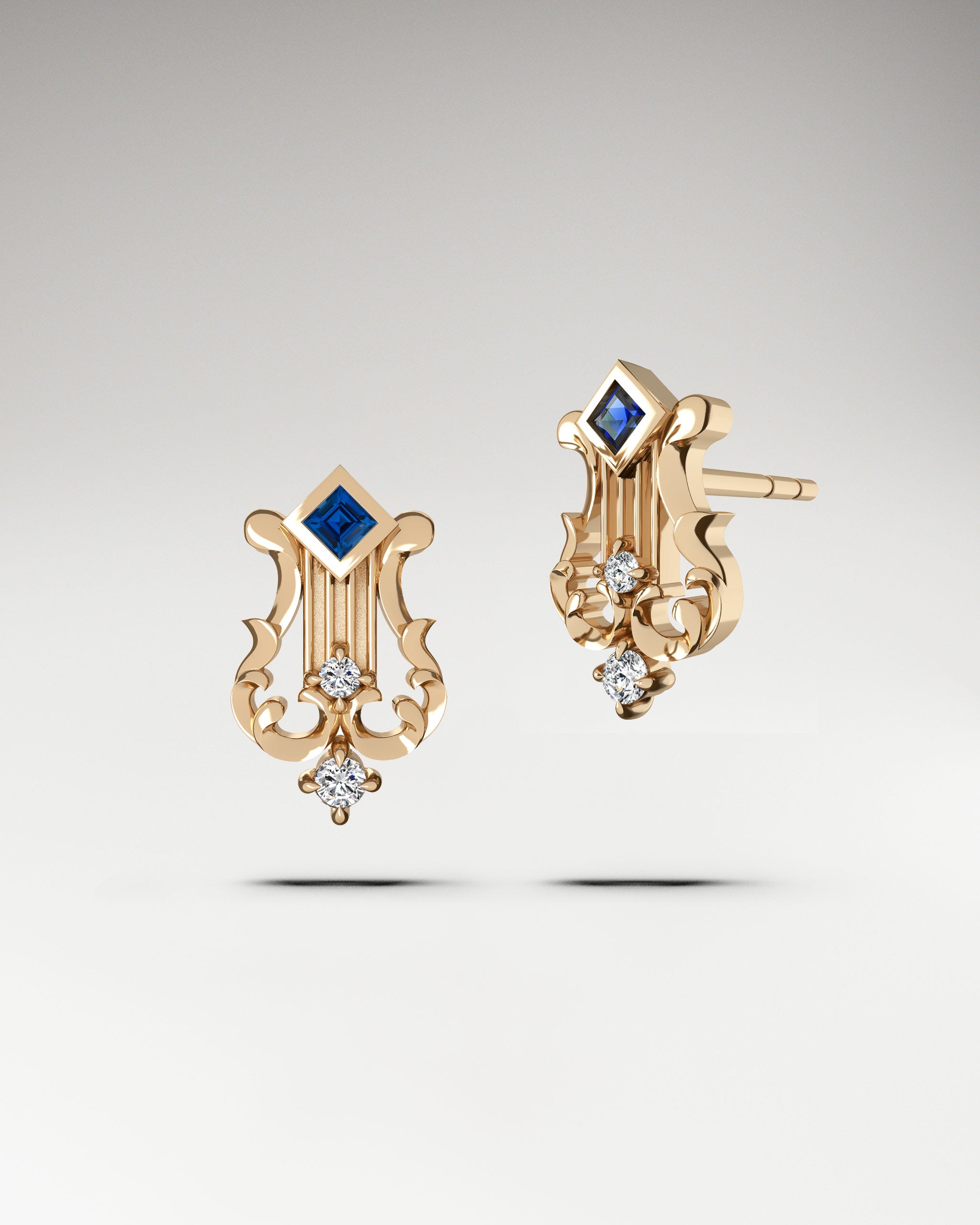 Lyre shapped earrings made in gold with diamonds and blue sapphire