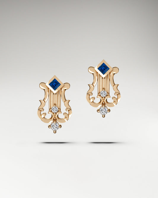 Lyre stud earrings made in gold with diamonds and sapphire