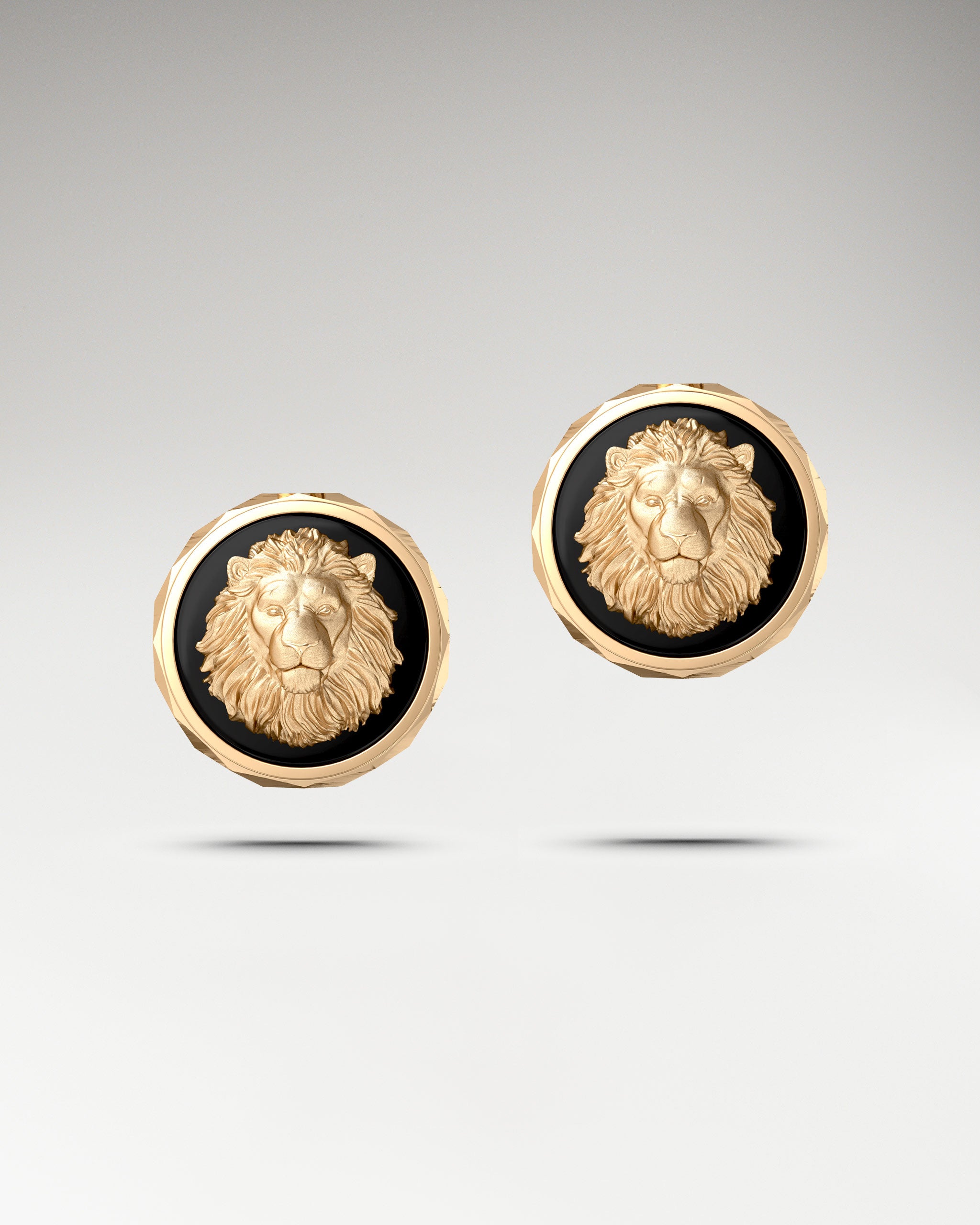 lion face sculpture earrings in 10k gold with black agate gemstone